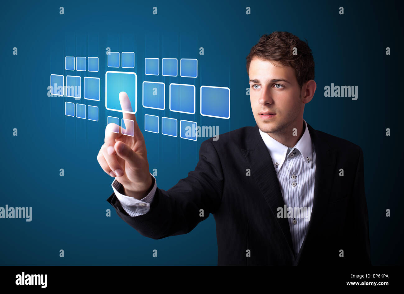 Businessman pressing high tech type of modern buttons Stock Photo