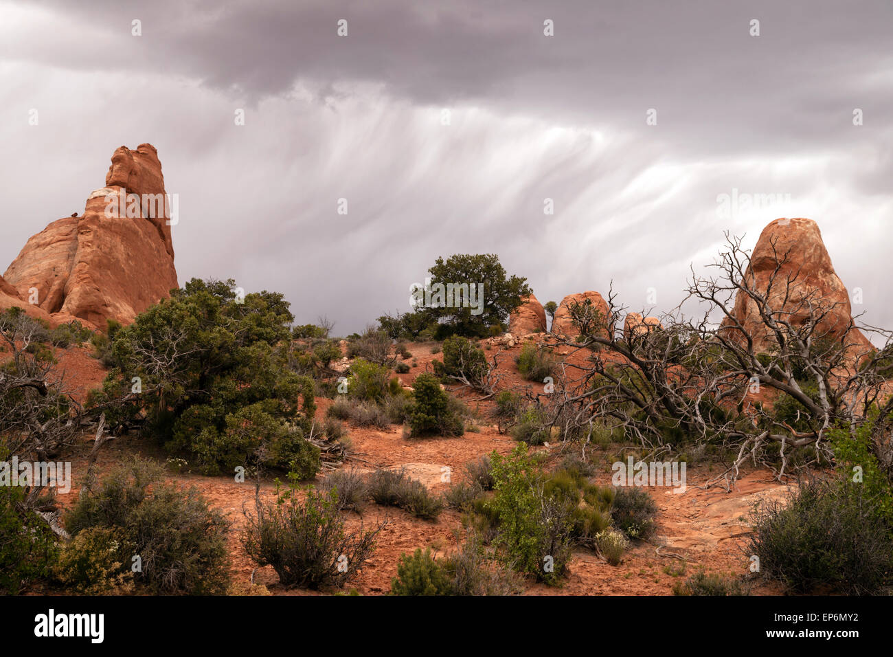 A horizontal compostion of rock buttes before it rains in the Utah Wilds Stock Photo
