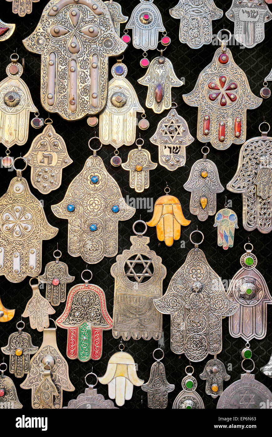 Silver and brass pendants, Hands of Fatima, good luck charms in a souvenir shop. Morocco Stock Photo