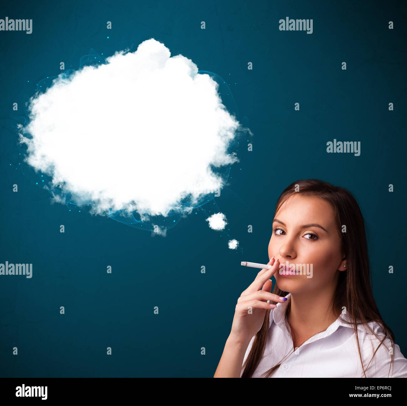Young woman smoking unhealthy cigarette with dense smoke Stock Photo