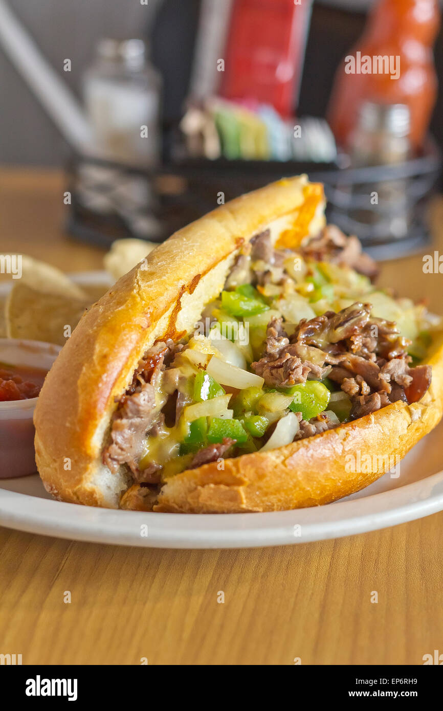 Philly Cheesesteak with diced onions peppers and mushrooms with