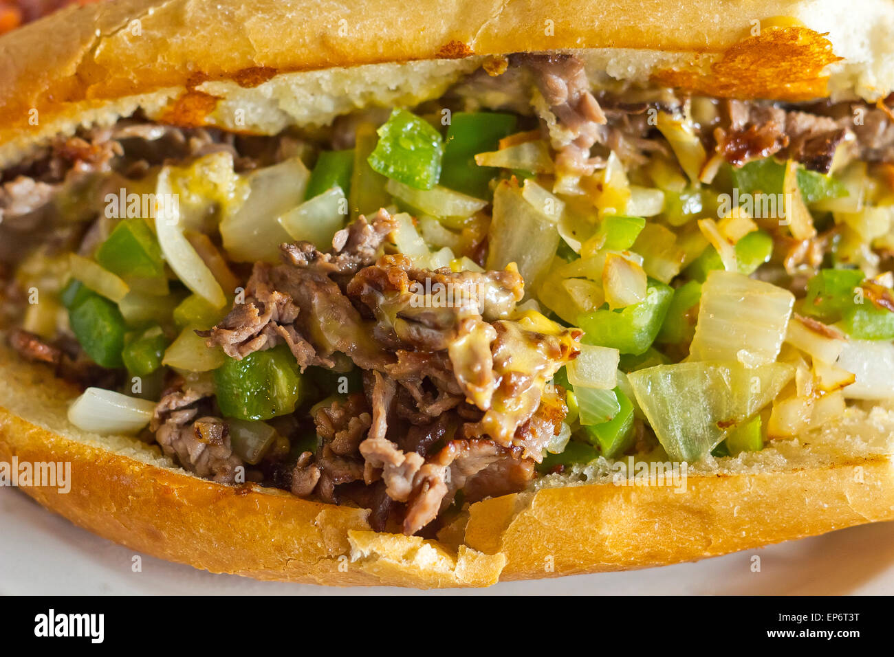 Philly Cheesesteak with diced onions peppers and mushrooms with