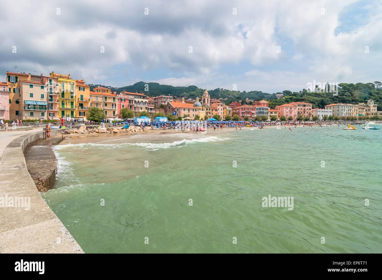 Lerici, Italy - June 29, 2014: locals and tourists enjoy San Terenzo beach and town in Lerici, Italy. Lerici is located in La Sp Stock Photo