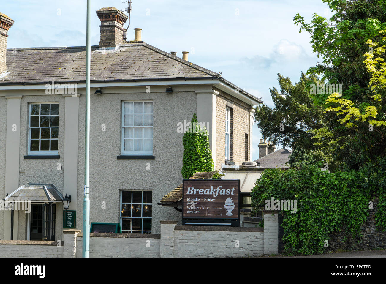 Traditional English Pub extrior view and menu and opening times on