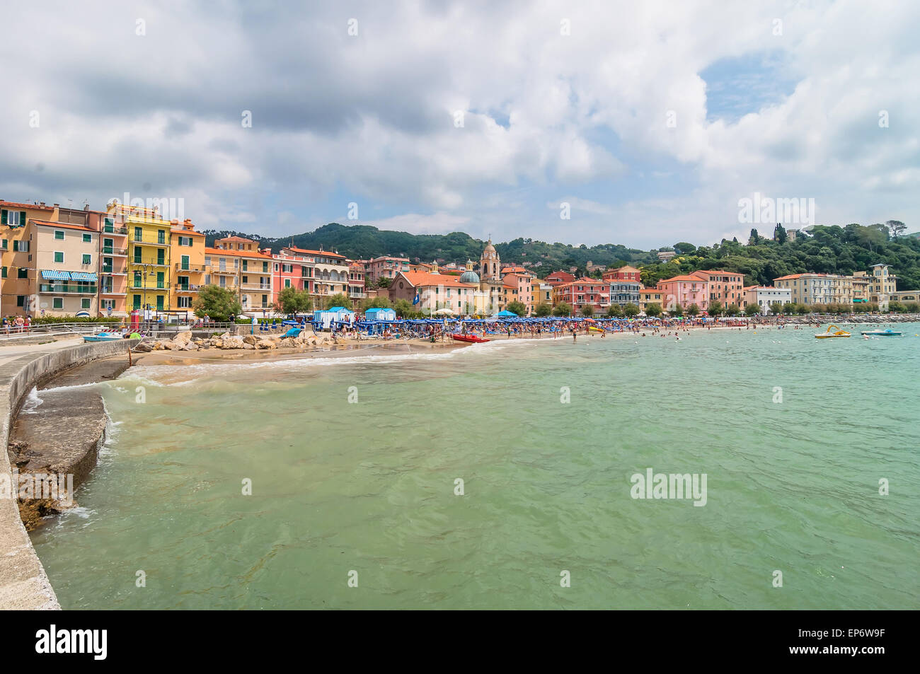 Lerici, Italy - June 29, 2014: locals and tourists enjoy San Terenzo beach and town in Lerici, Italy. Lerici is located in La Sp Stock Photo