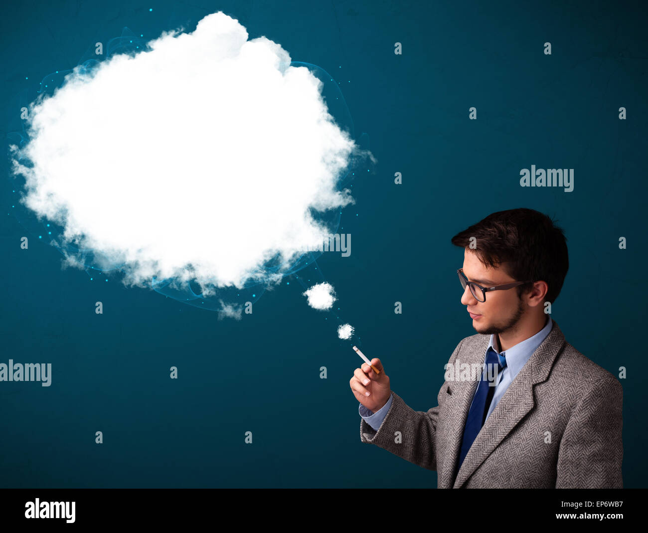Young man smoking unhealthy cigarette with dense smoke Stock Photo - Alamy