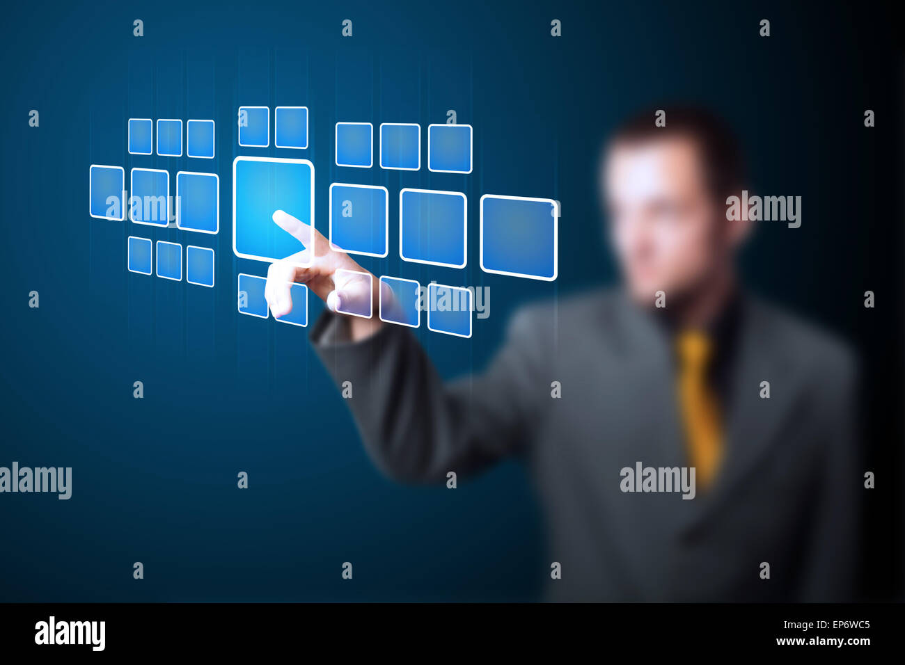 Businessman pressing high tech type of modern buttons Stock Photo