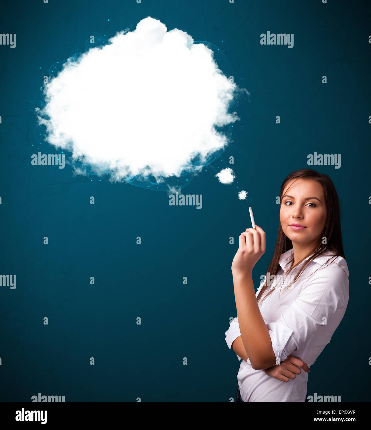 Young woman smoking unhealthy cigarette with dense smoke Stock Photo
