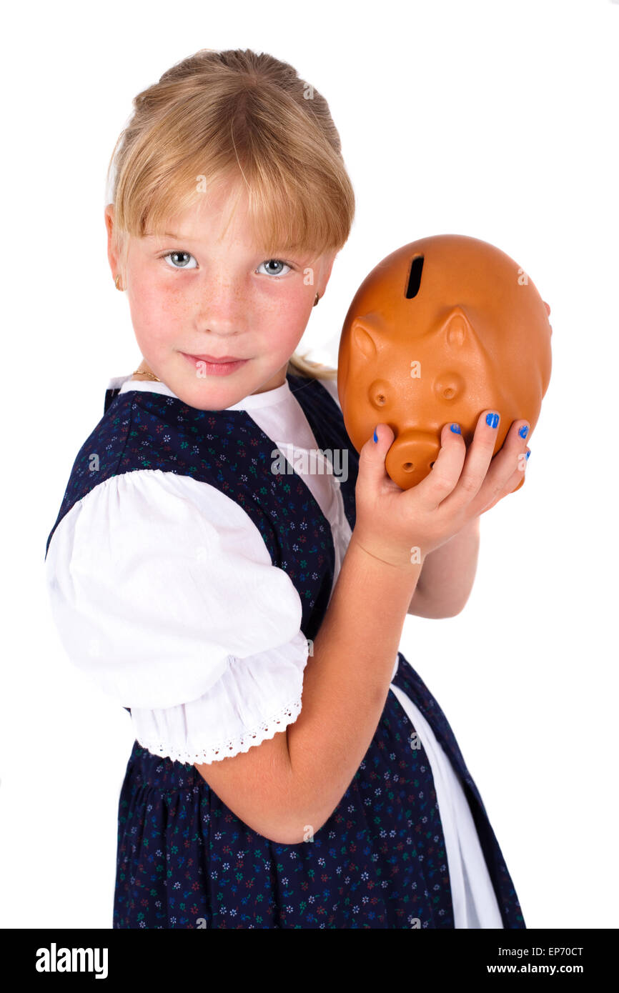 Cute little girl saving money in a piggy-bank Stock Photo - Alamy