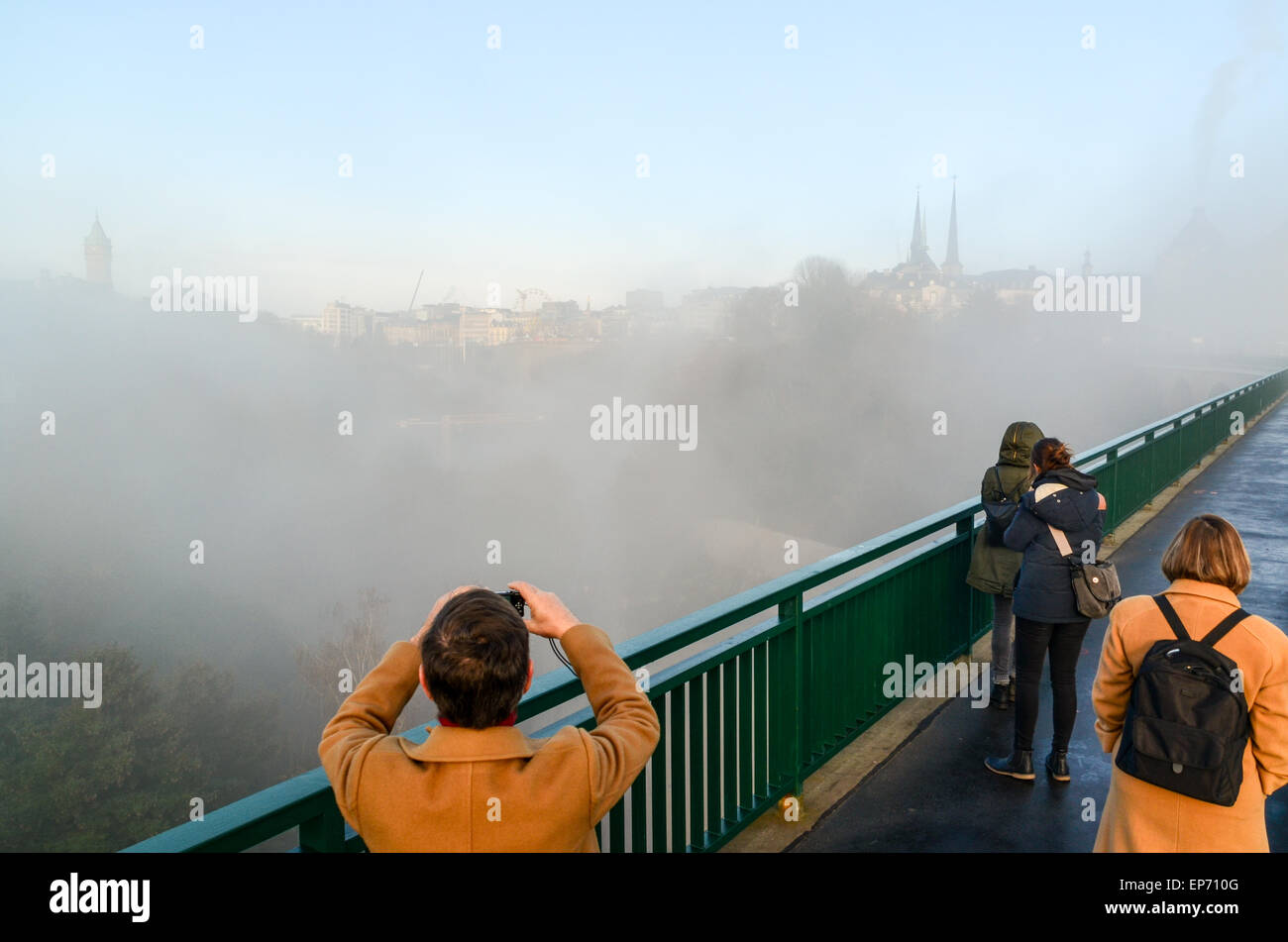 Tourists photographing the cathedral in the city of Luxembourg from the bridge over the Pétrusse Stock Photo