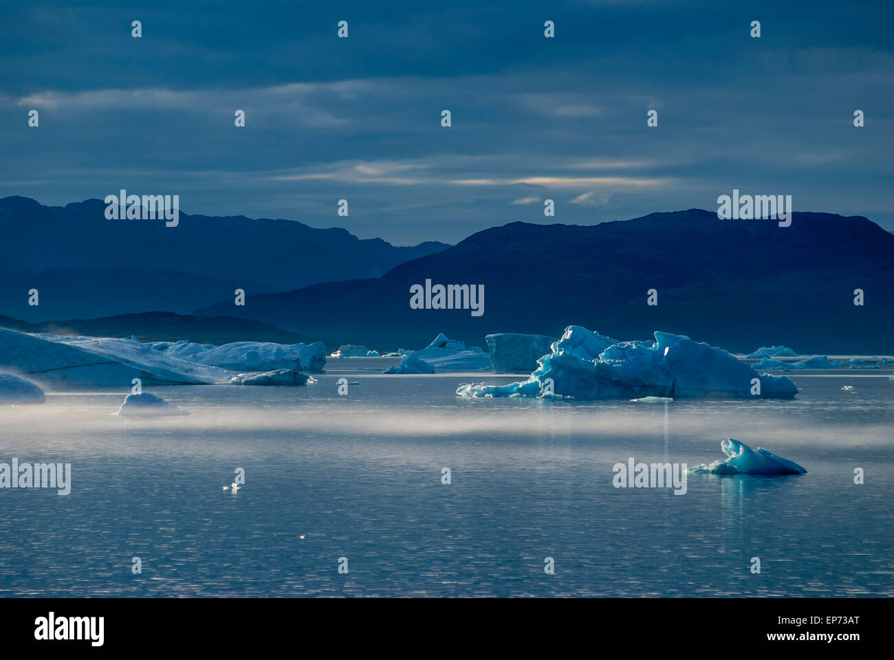 Icebergs in Narsuaq, Greenland at sunset Stock Photo