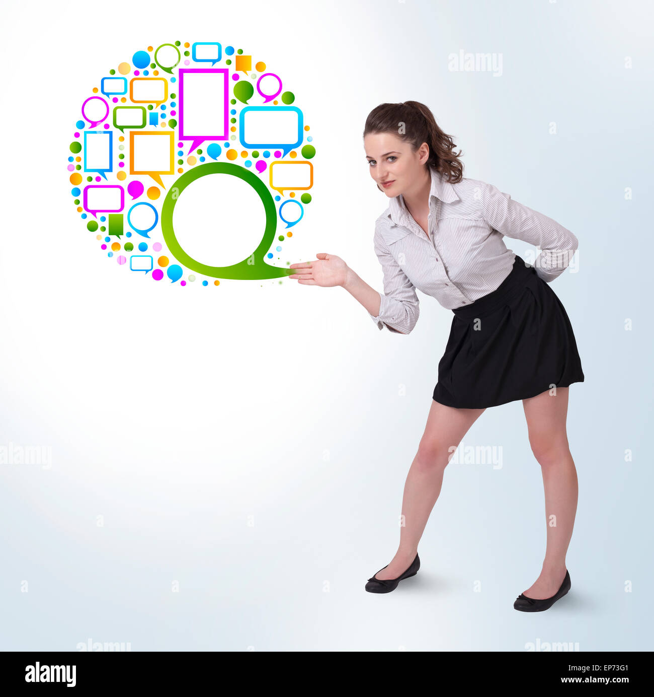 Young business woman presenting colourful speach bubble Stock Photo - Alamy