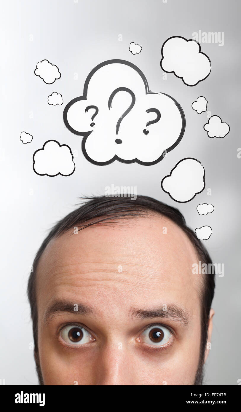 Young guy with question mark over his head Stock Photo
