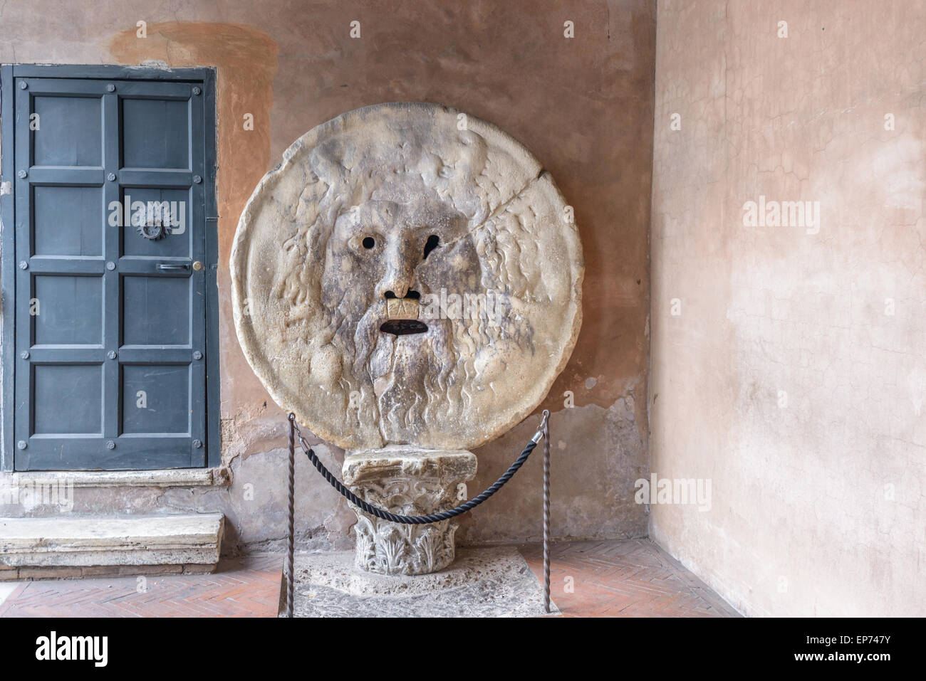 is an image, carved from Pavonazzo marble, of a man-like face, located in the portico of the church of Santa Maria in Cosmedin i Stock Photo