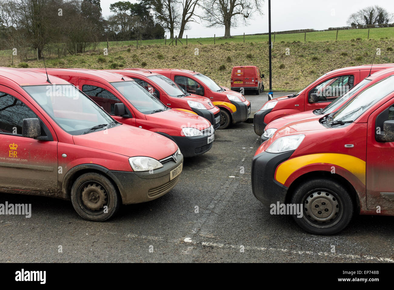 Royal Mail red delivery vans parked at local sorting office, Gloucestershire, UK Stock Photo