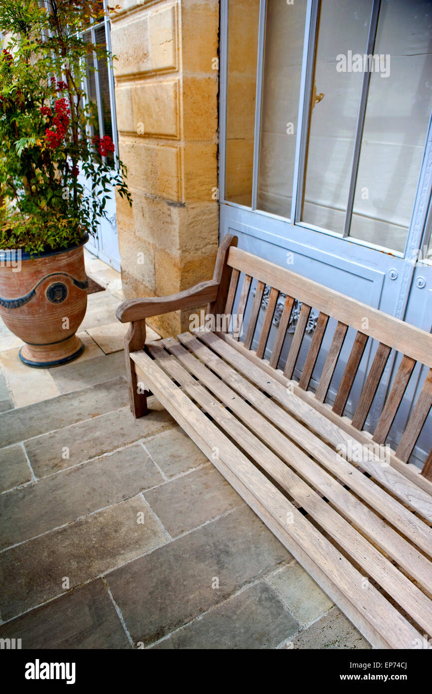 Wooden Bench And Plants On A Stone Terrace Stock Photo 82521058