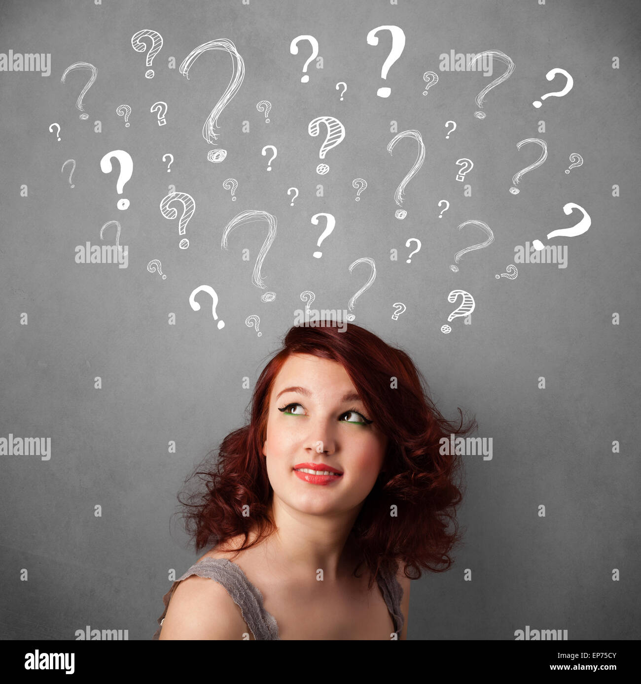 Young woman with question marks above her head Stock Photo - Alamy
