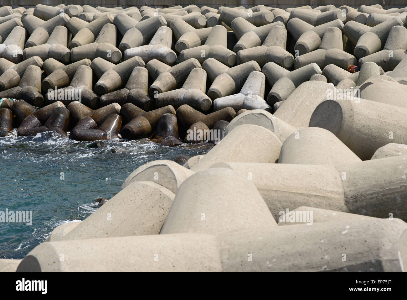 stacked tetrapod at a breakwater in Korea Stock Photo