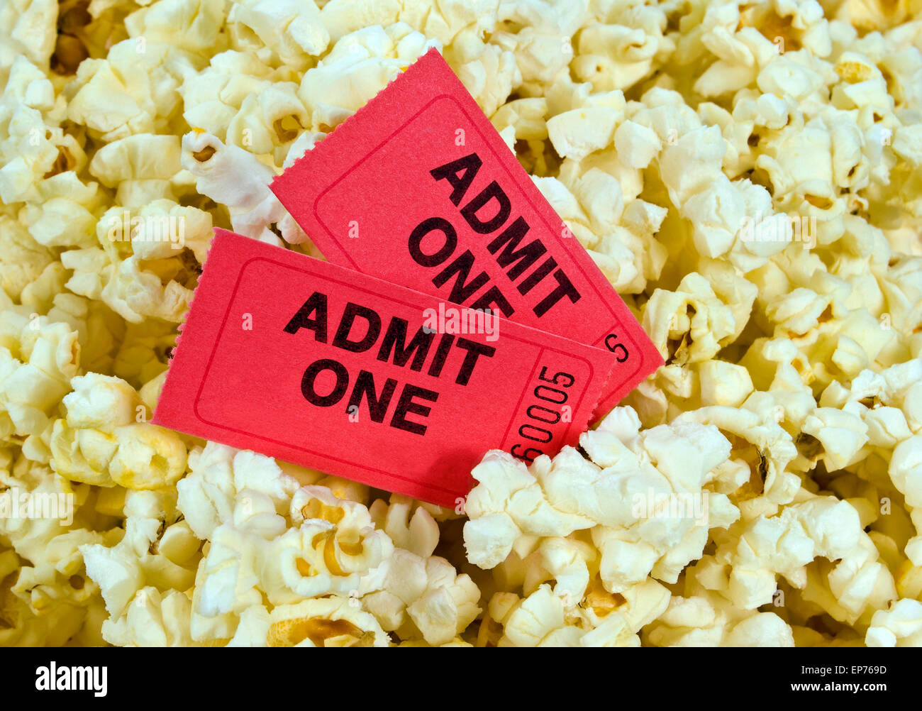Movie Tickets In Center Of Fresh Popcorn Popcorn.  Summer Fun At The Movies Stock Photo