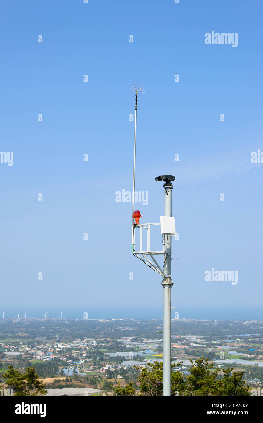 lgihtning rod and cctv camera for fire prevention at the top of Jeoji Oreum in Jeju Island, Korea. Stock Photo