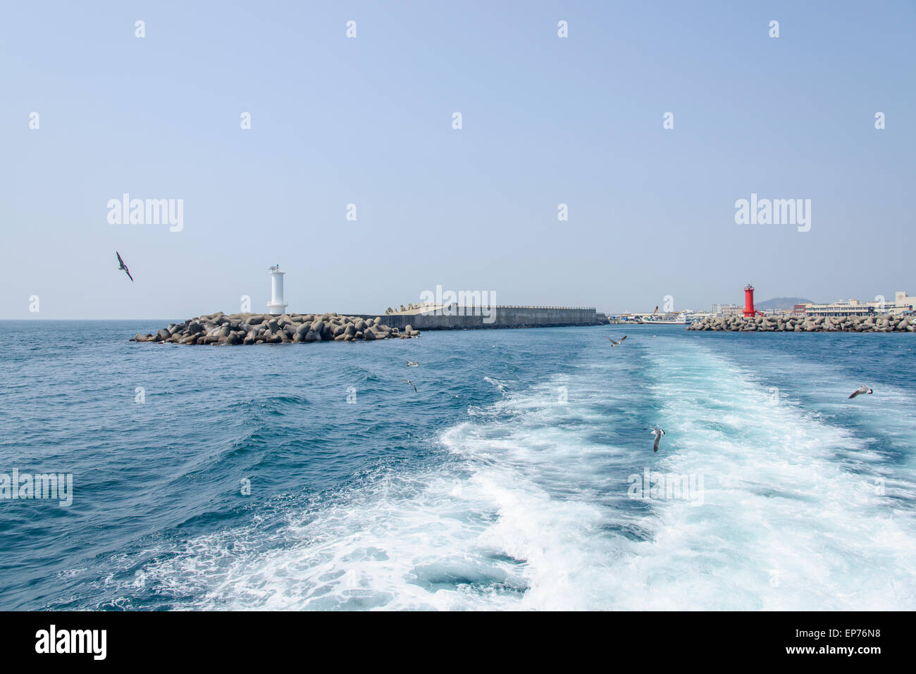 seawall with lighthouses in the Moseulpo in Jeju Island, Korea. Stock Photo