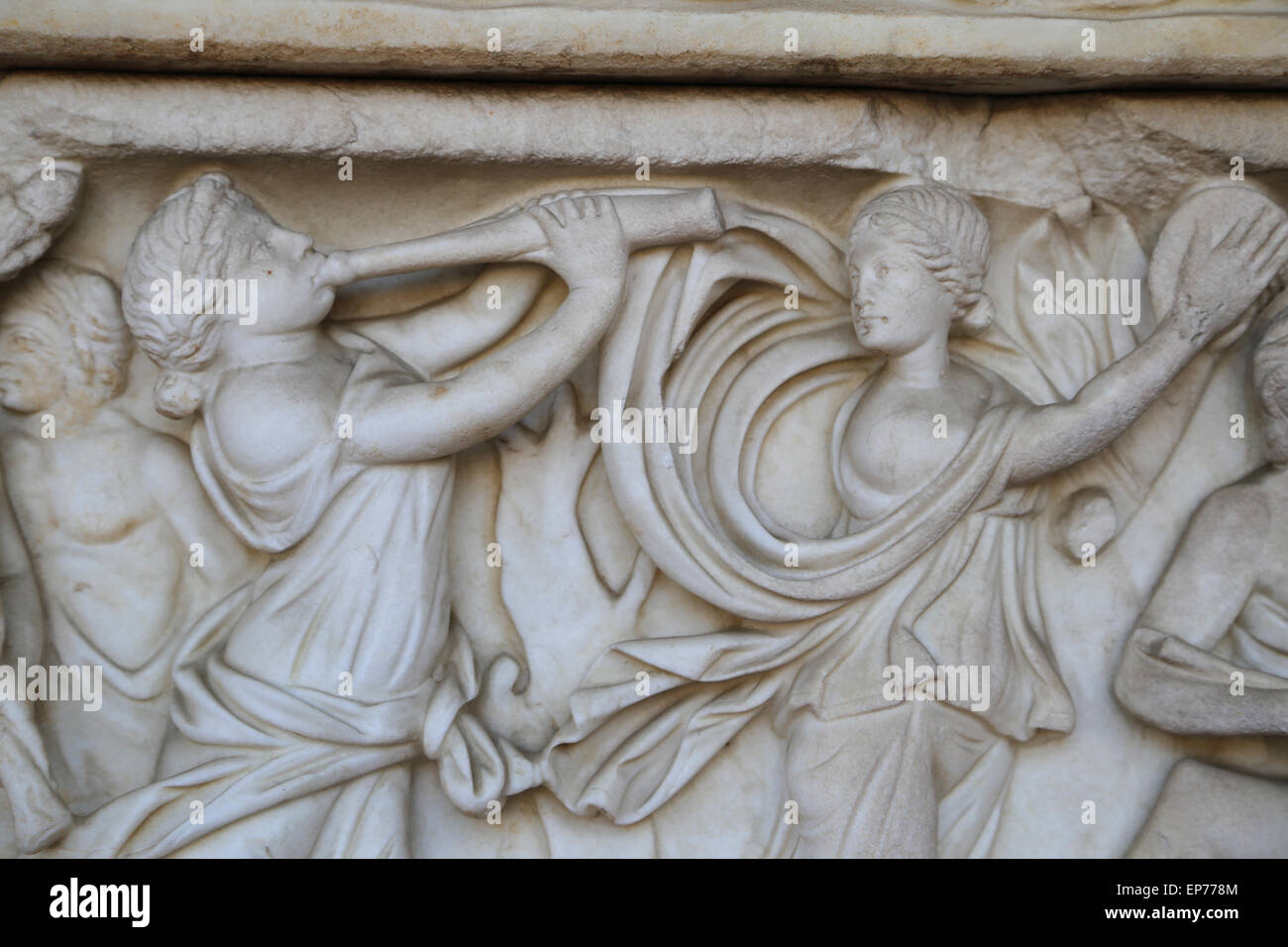 Sarcophagus with Dionysiac ceremonial procession. Maenads dancing. 2nd C. Roman style. Relief. Stock Photo