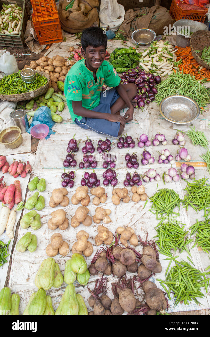 Smiling boy selling vegetables in the vegetable Market at Tanjore Stock Photo