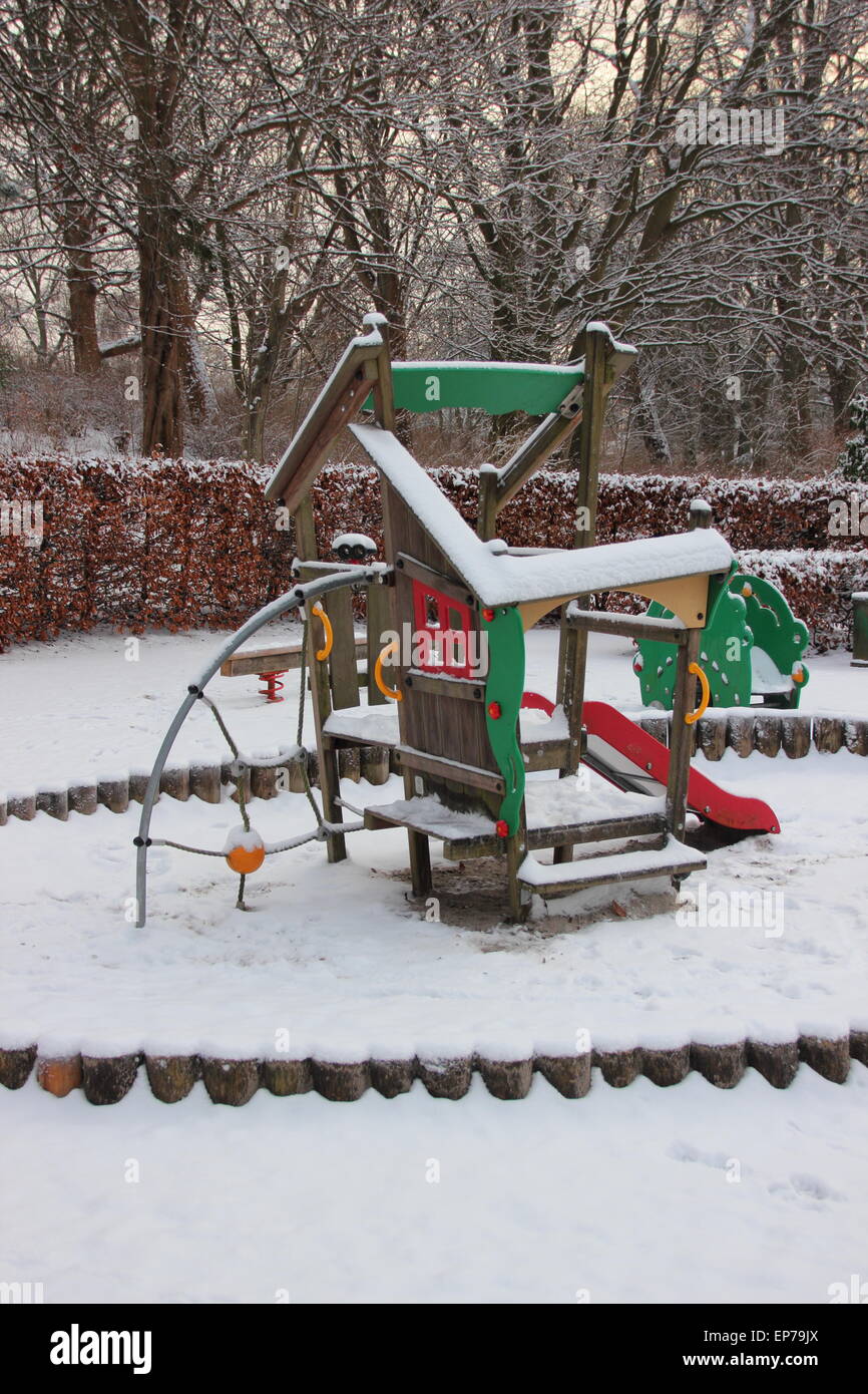 Public Children Playground  in Winter covered with Snow. No Kids around. Stock Photo