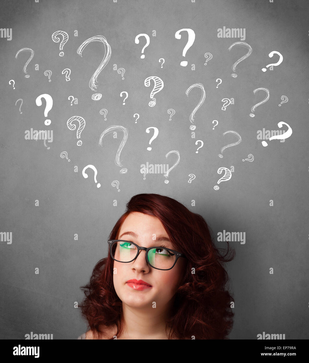 Young woman with question marks above her head Stock Photo - Alamy