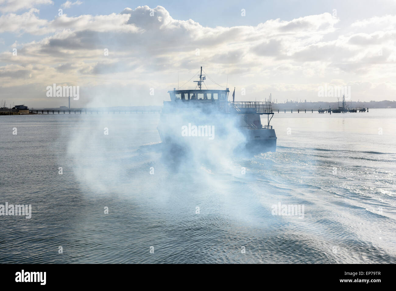 A boat throws  out diesel fuel smoke pollution Stock Photo