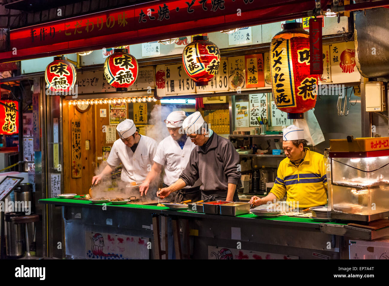 Japanese chefs prepare takoyaki and other snack foods at a stall in Osaka, Japan Stock Photo Alamy