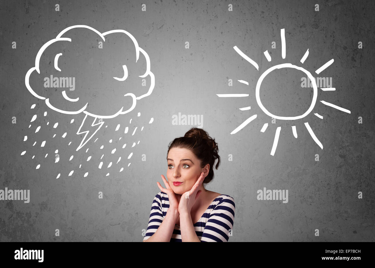 Woman standing between a sun and a rain drawing Stock Photo - Alamy