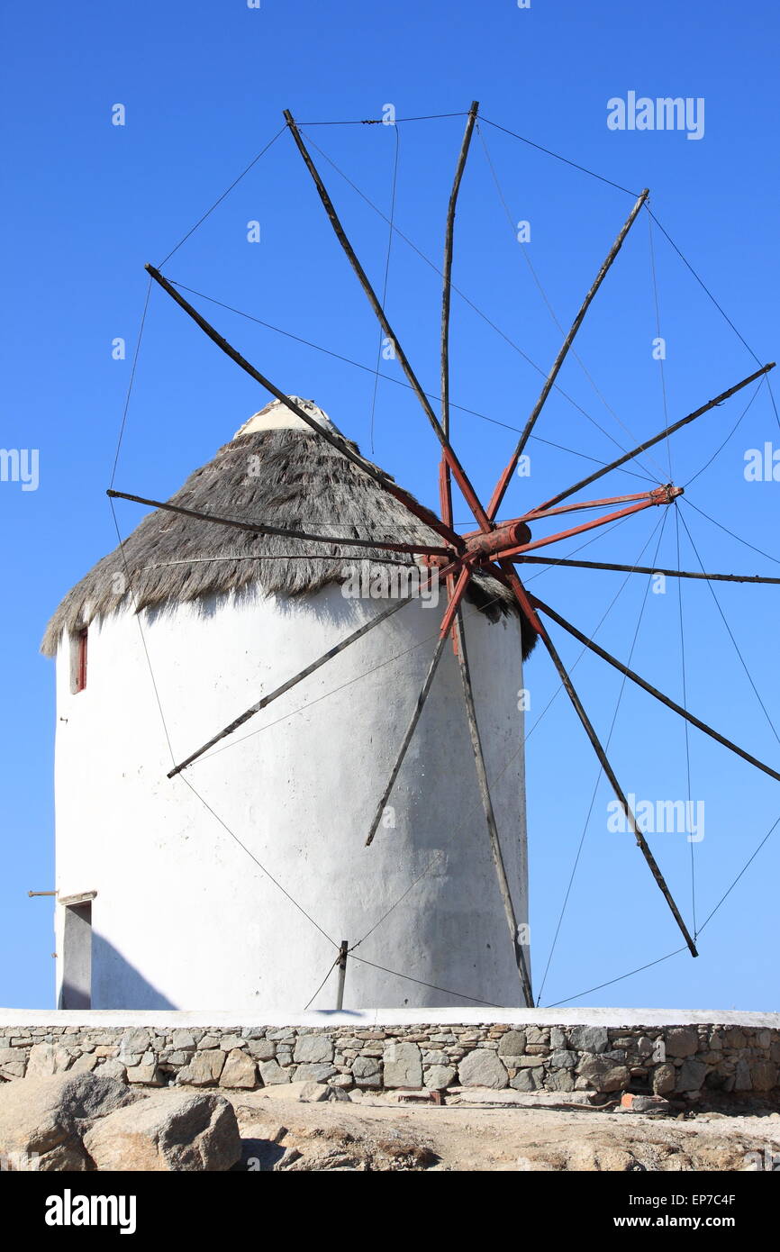 Typical windmill on a hillside near the sea in Mykonos Island, Greece Stock Photo