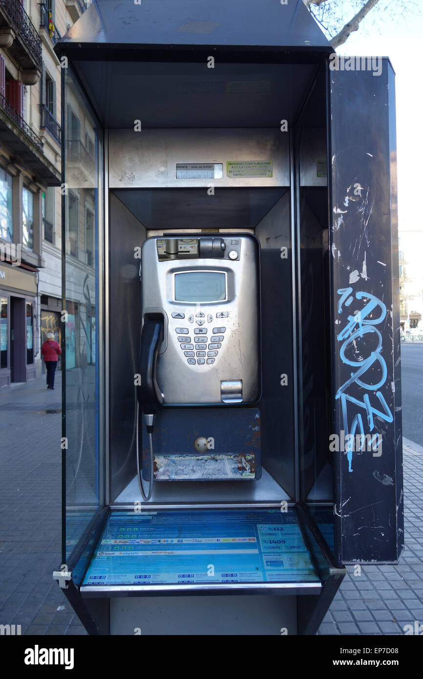 Public telephone in the street in Barcelona Stock Photo