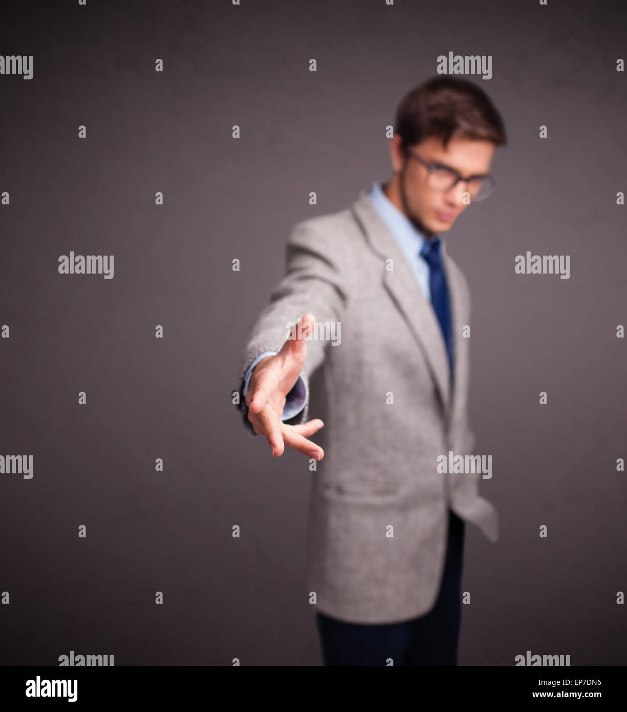 Young man standing and throwing something Stock Photo Alamy