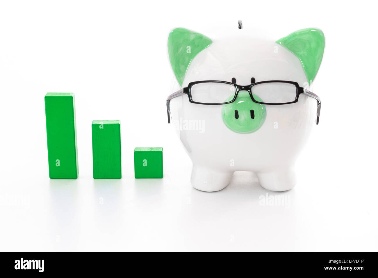 Piggy bank wearing glasses with green graph model Stock Photo - Alamy