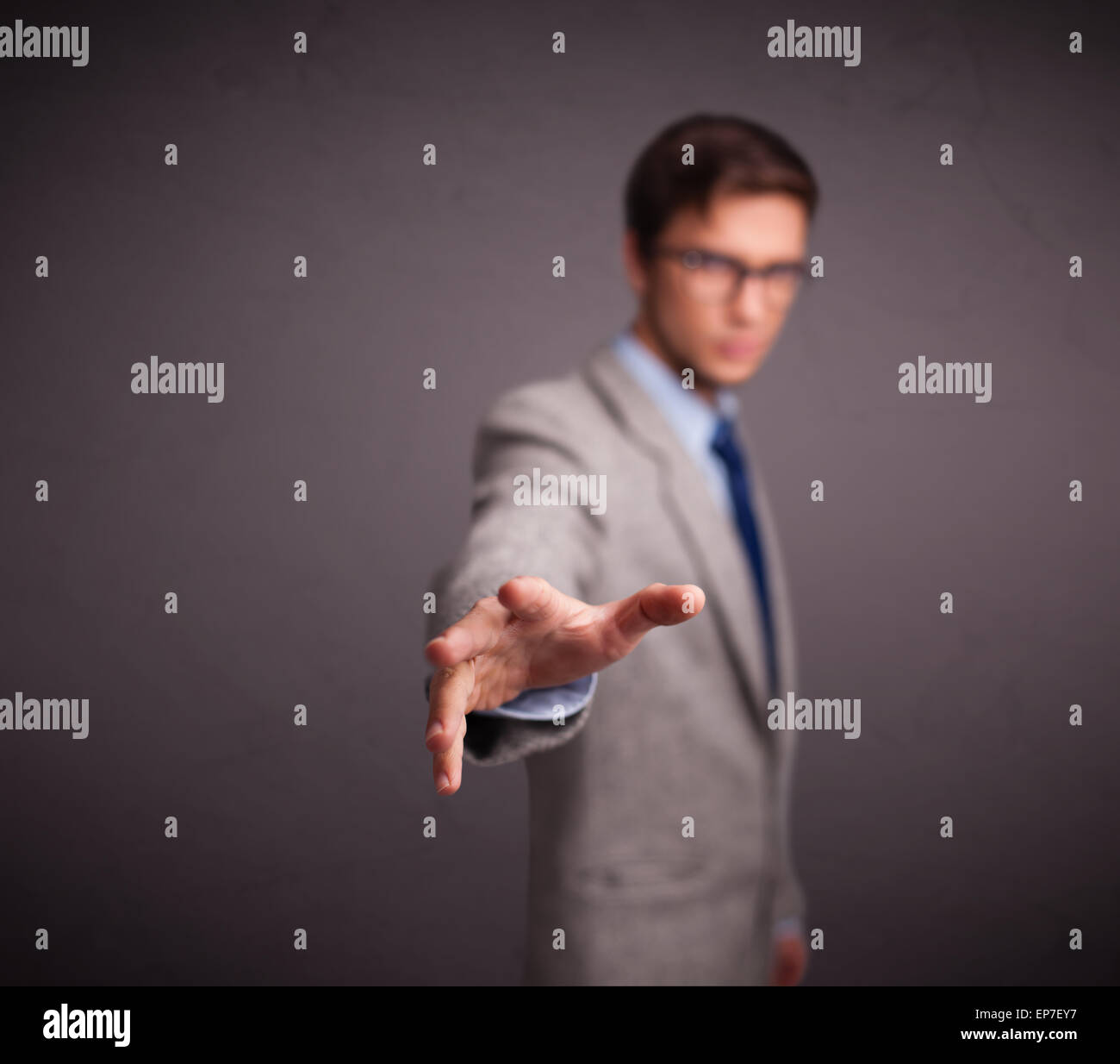 Young man standing and throwing something Stock Photo Alamy