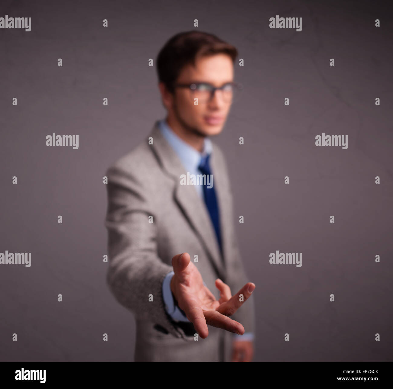 Young man standing and throwing something Stock Photo Alamy