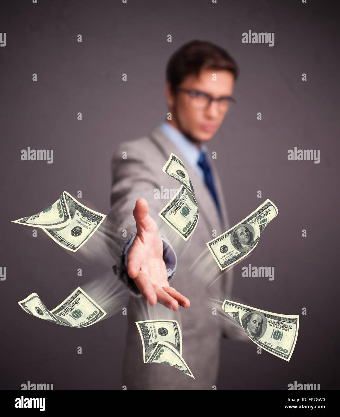 Young man throwing money Stock Photo Alamy