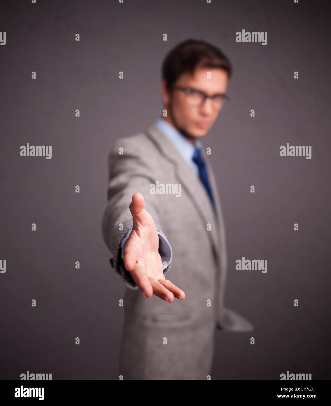 Young man standing and throwing something Stock Photo Alamy