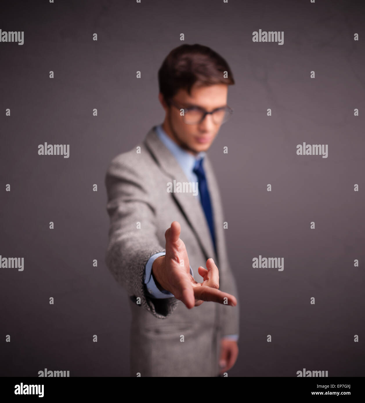 Young man standing and throwing something Stock Photo Alamy