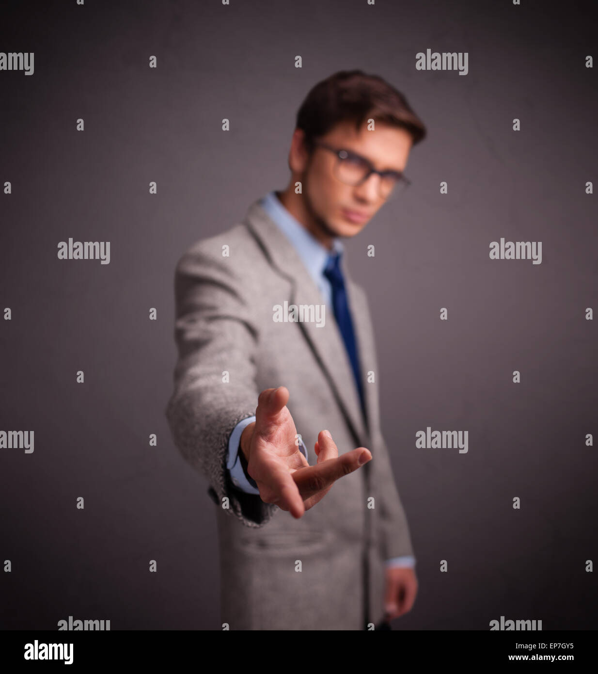 Young man standing and throwing something Stock Photo Alamy