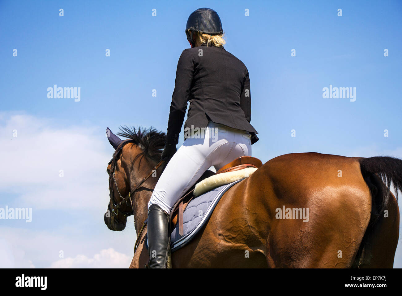 A rider on horseback competing in equestrian tournament Stock Photo