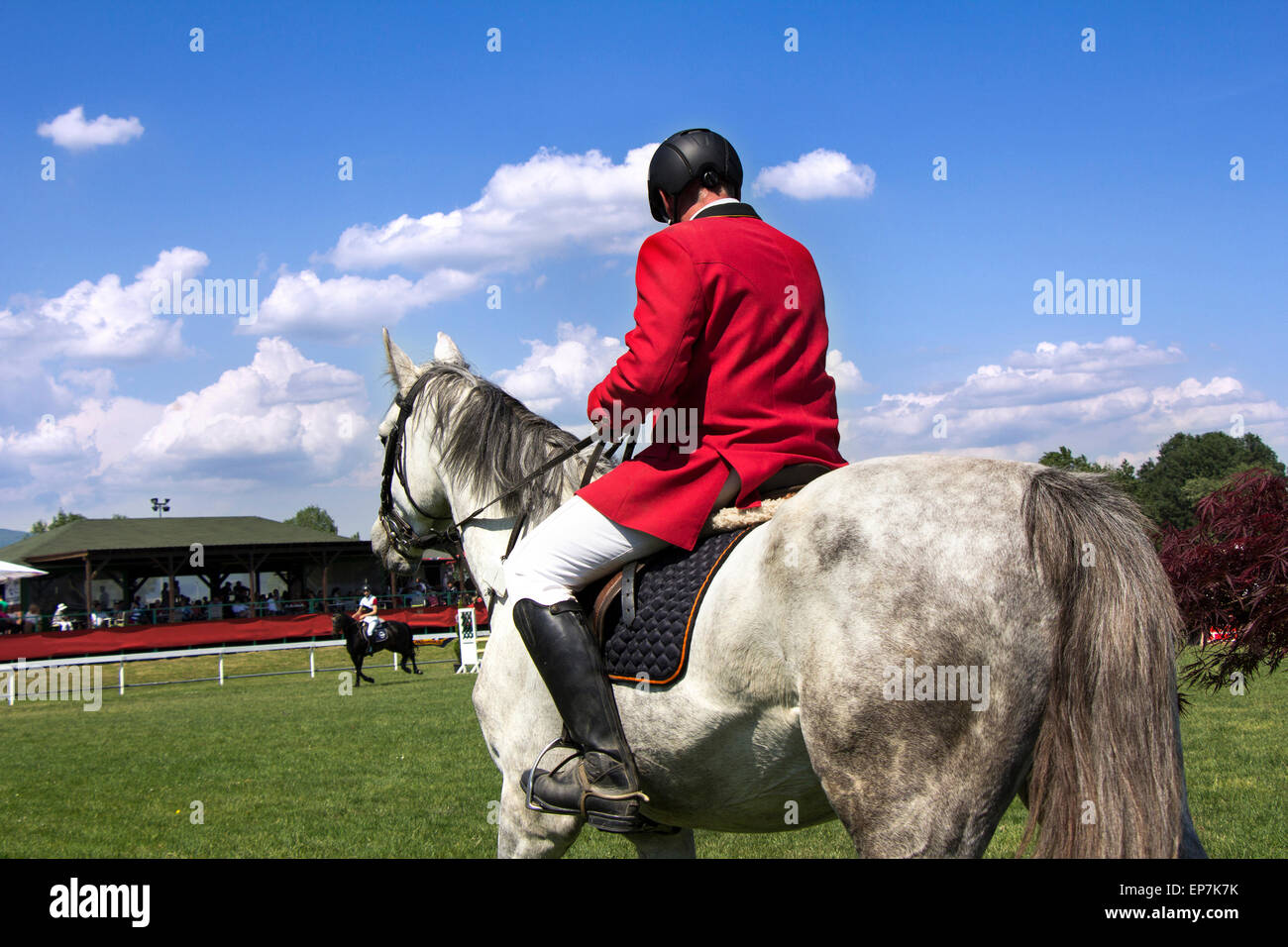 A rider on horseback competing in equestrian tournament Stock Photo