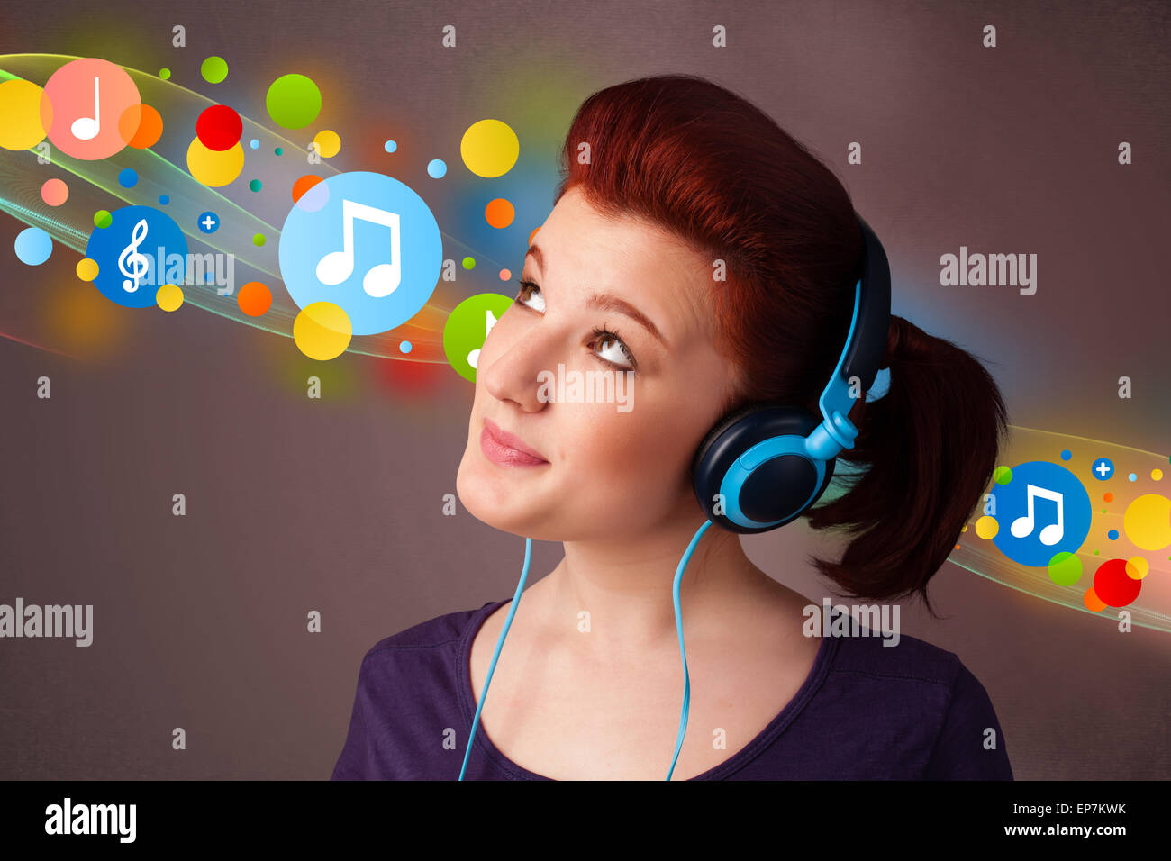 Young woman listening to music with headphones Stock Photo - Alamy