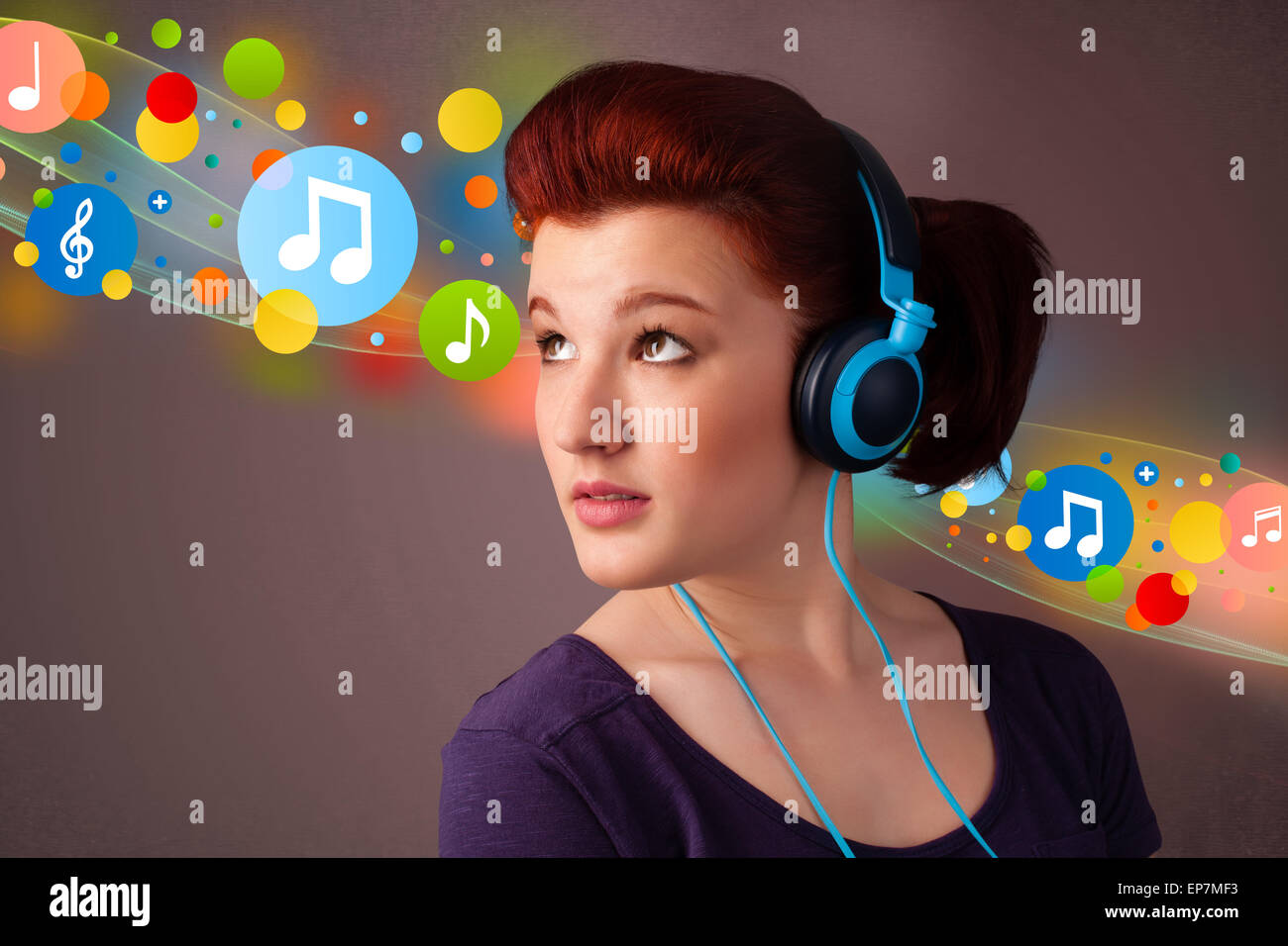 Young woman listening to music with headphones Stock Photo - Alamy