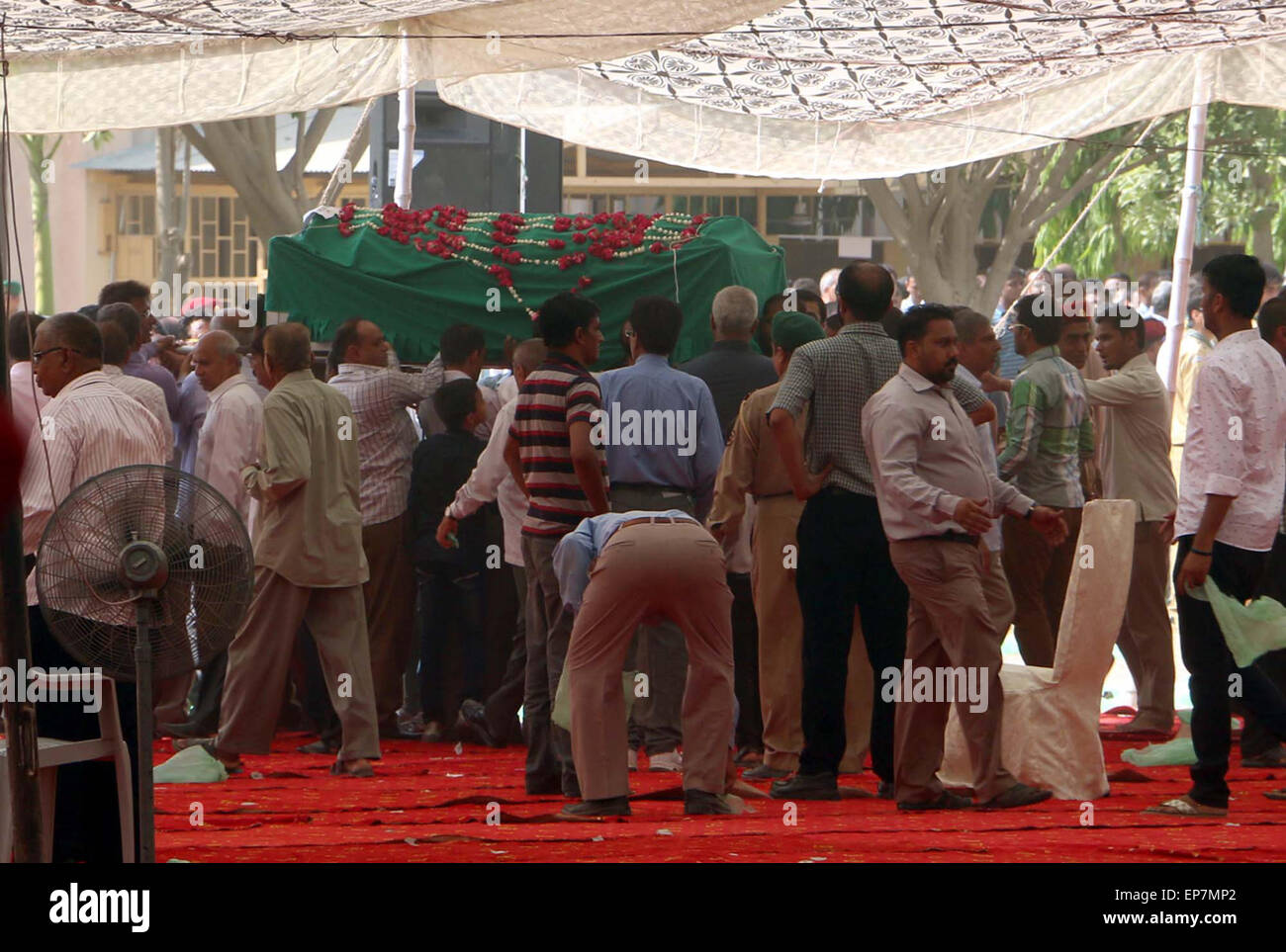People from Ismaili Community are carrying coffin after funeral prayer