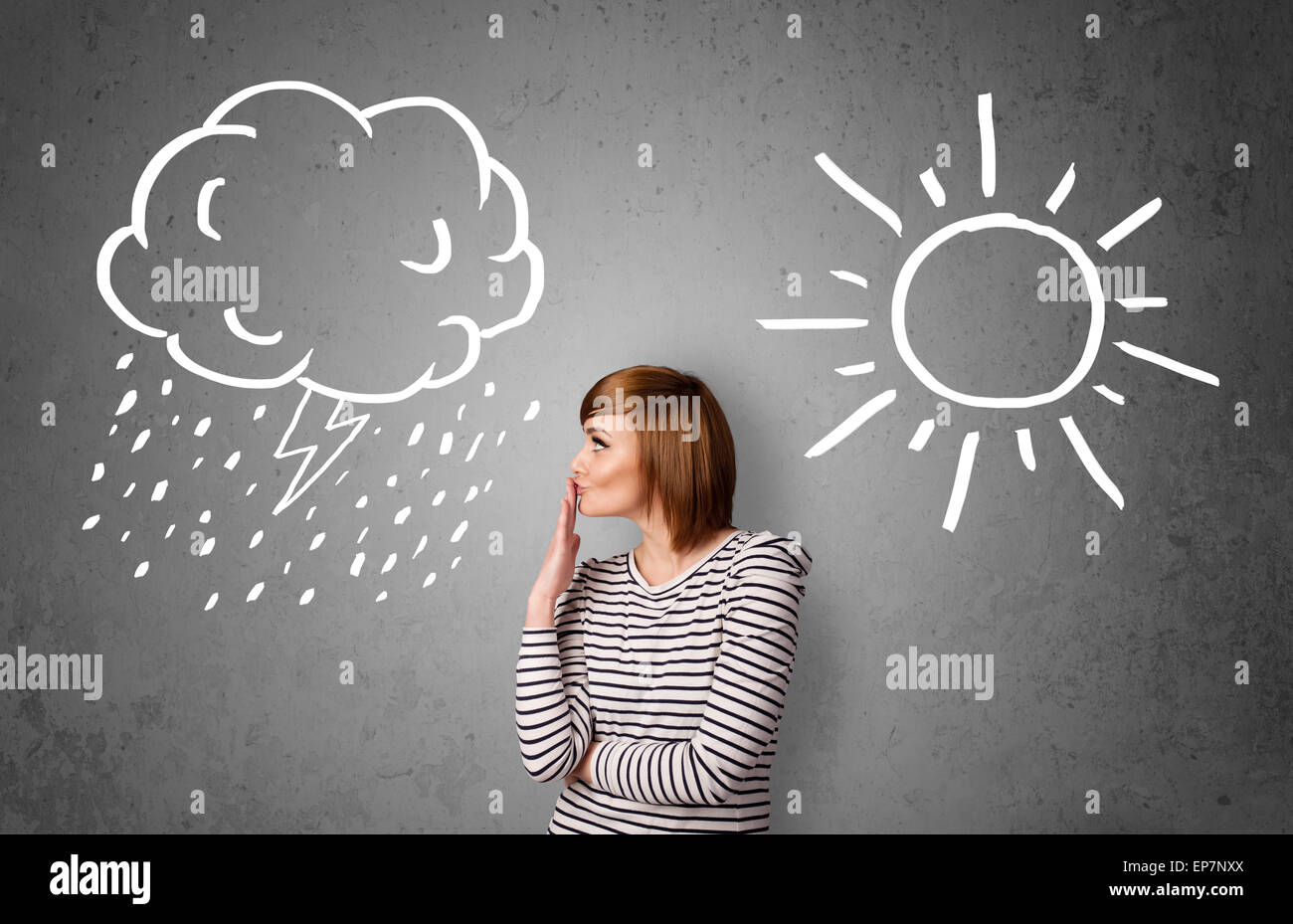 Woman standing between a sun and a rain drawing Stock Photo - Alamy