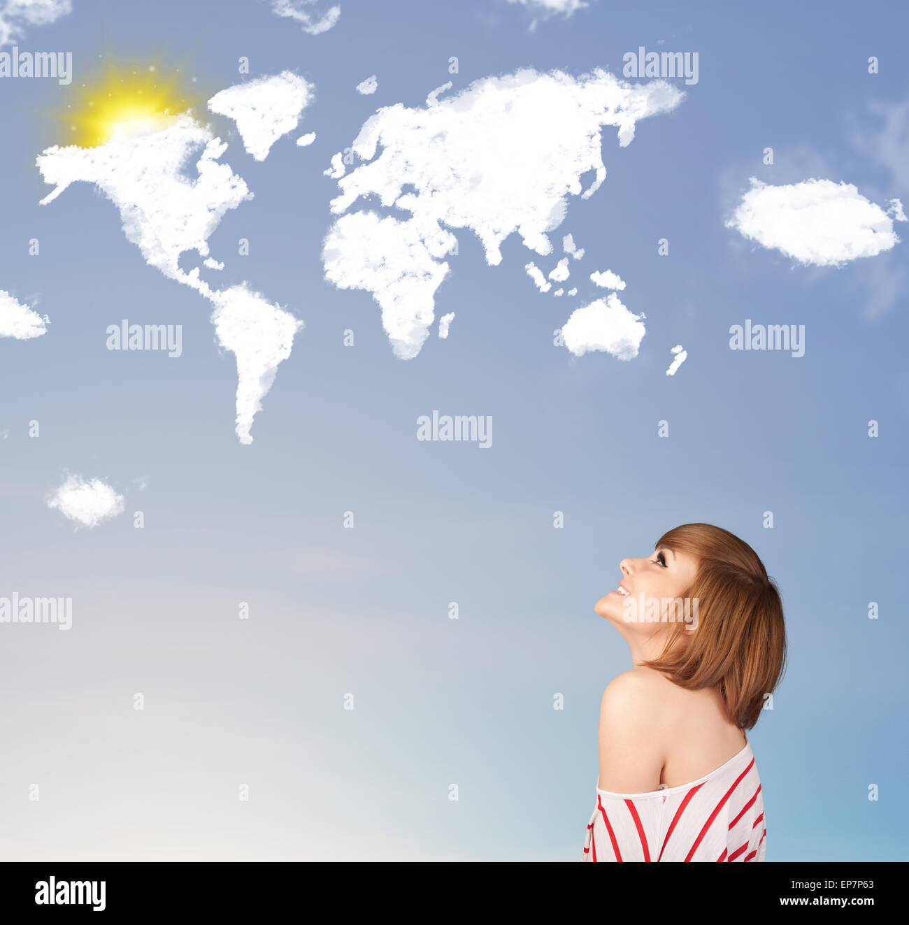 Young girl looking at world clouds and sun on blue sky Stock Photo - Alamy