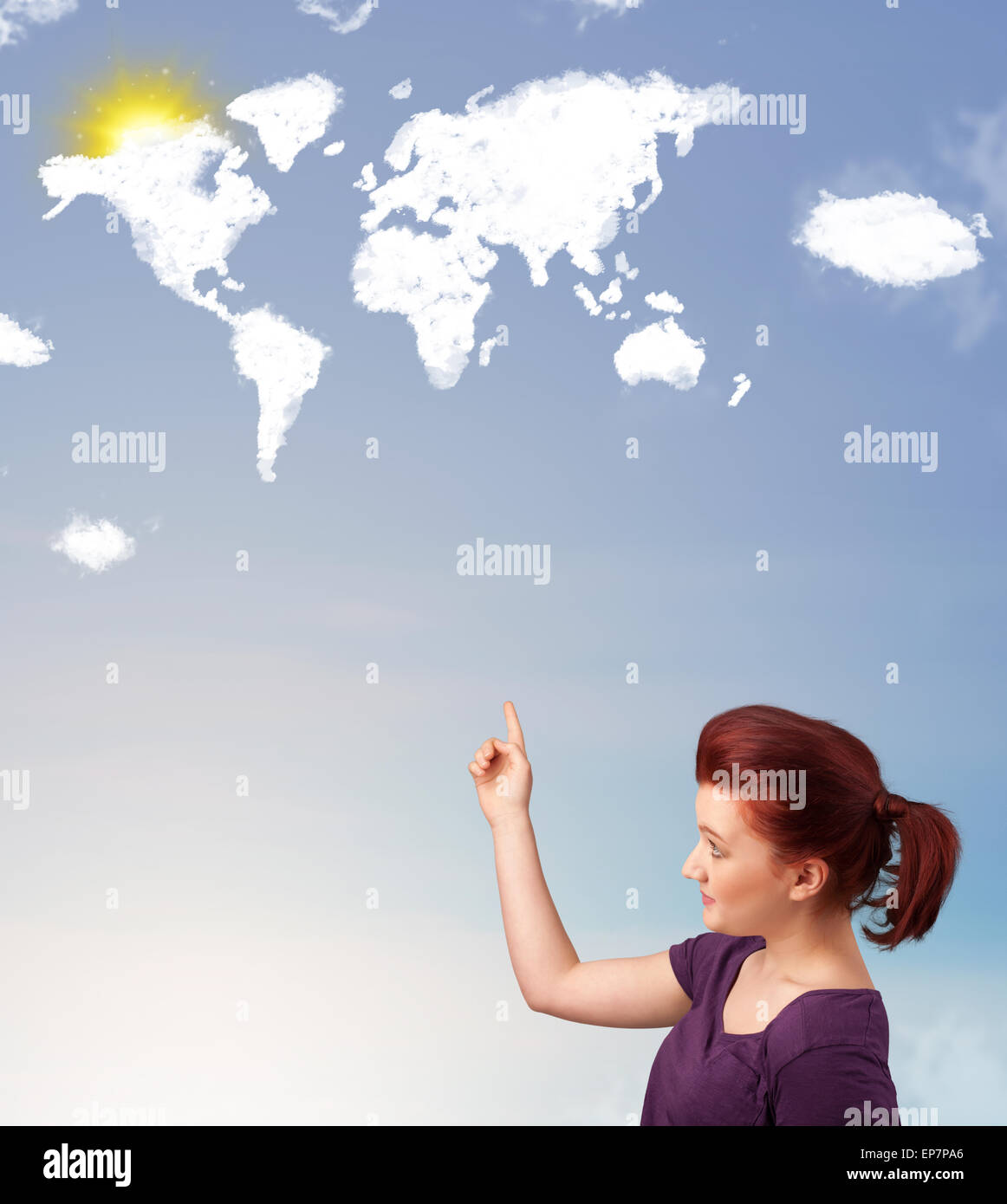 Young girl looking at world clouds and sun on blue sky Stock Photo - Alamy